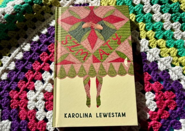Szmaty, the book on a granny-square blanket
